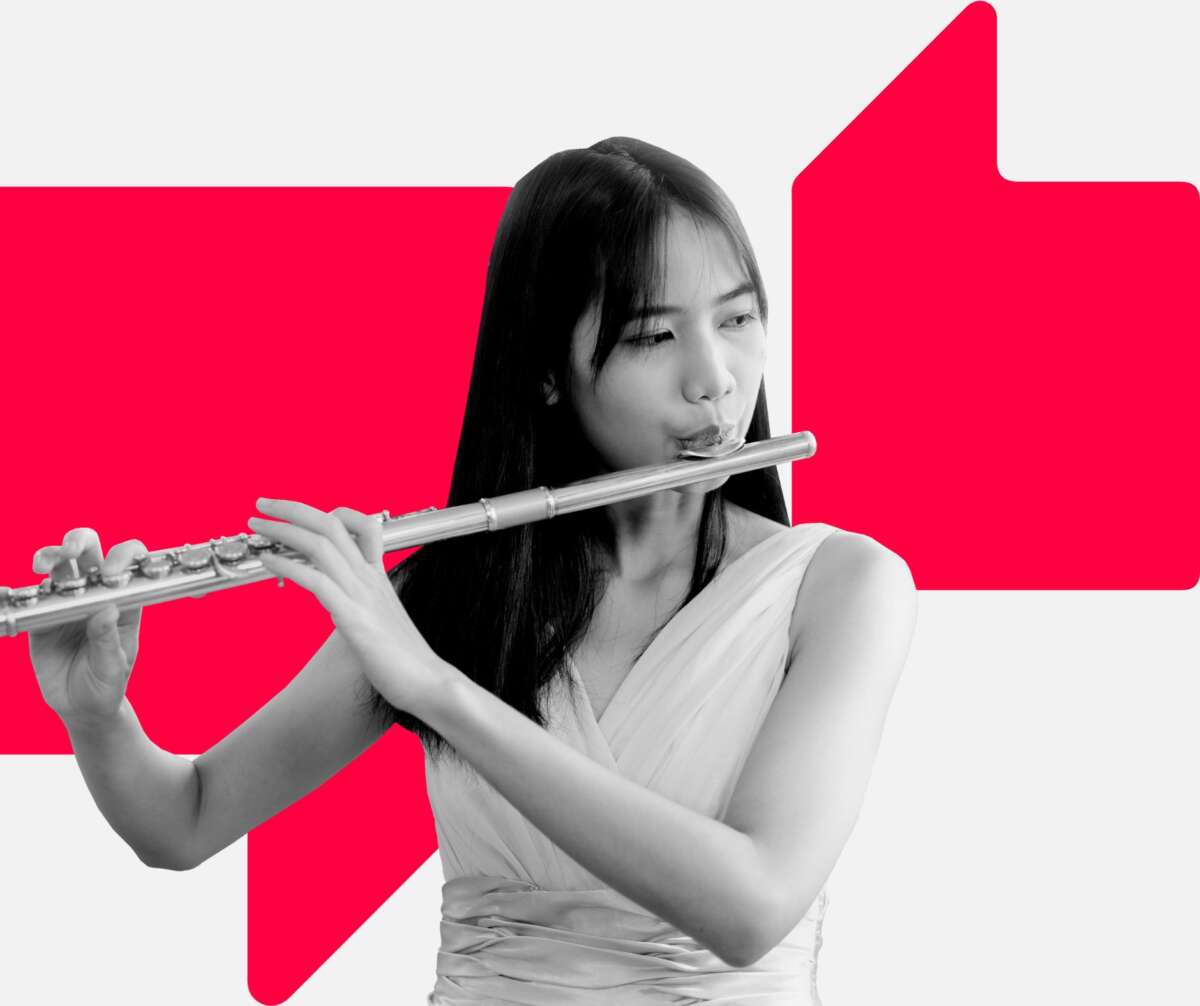 A young person playing the flute